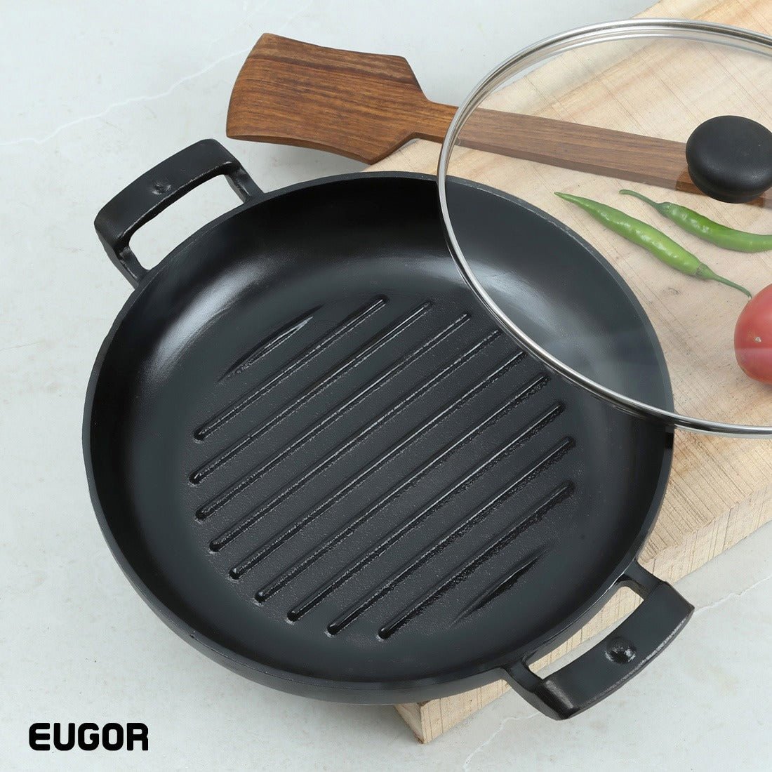 A black cast iron grill pan with a ribbed surface